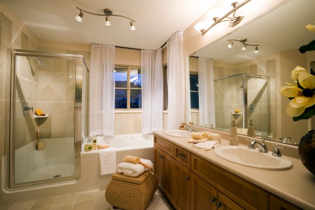 https://www.pricesplumbing.com/wp-content/uploads/2021/06/Mesmerizing-Bathroom-Remodeling-with-Track-Lightings-Completed-with-Shower-Bath-and-Bathtub-Furnished-with-Vanity-Coupled-by-Double-Sink-and-Large-Mirror-640x426.jpg